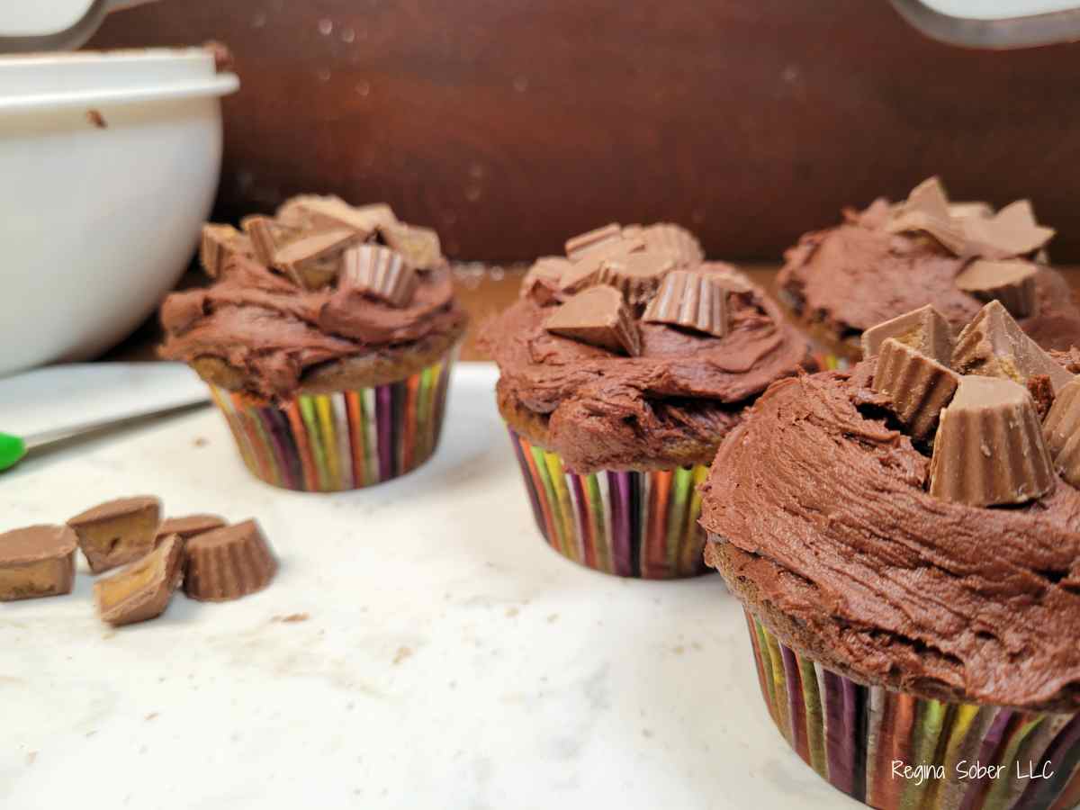 chocolate peanut butter cupcakes on cutting board