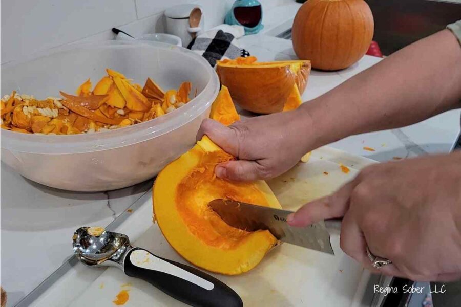 cutting pumpkin into sections
