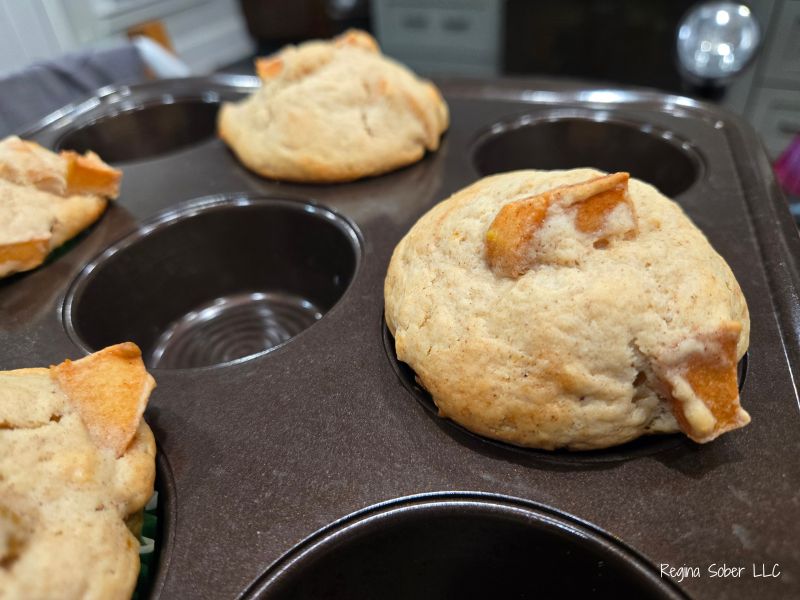 cinnamon apple muffins baked in muffin tin