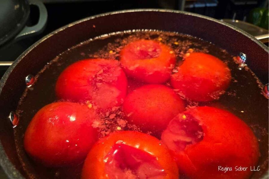 blanching cored tomatoes makes easy work of removing the skins