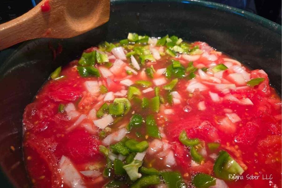chopped onions and peppers added into the chopped tomatoes