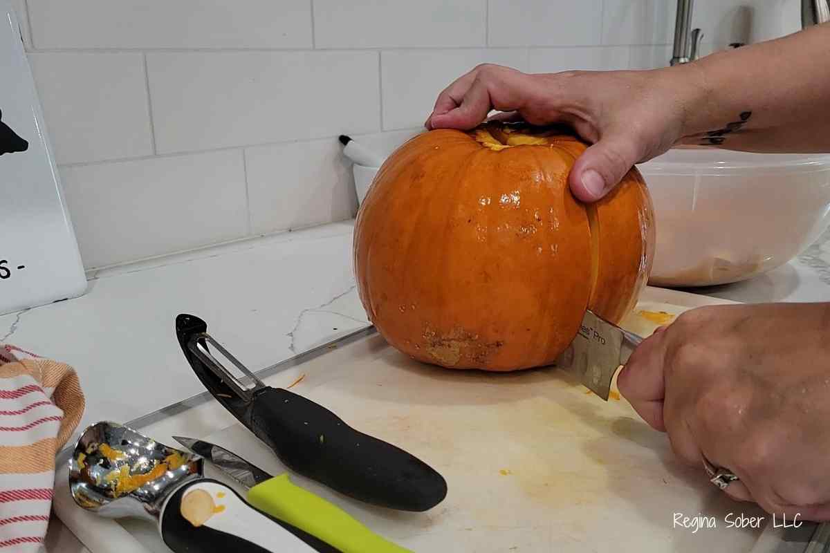 cutting pumpkin in half