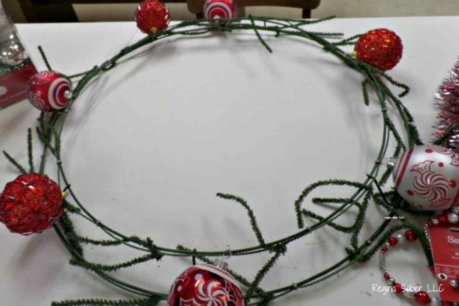 adding ornaments onto ring for even placement