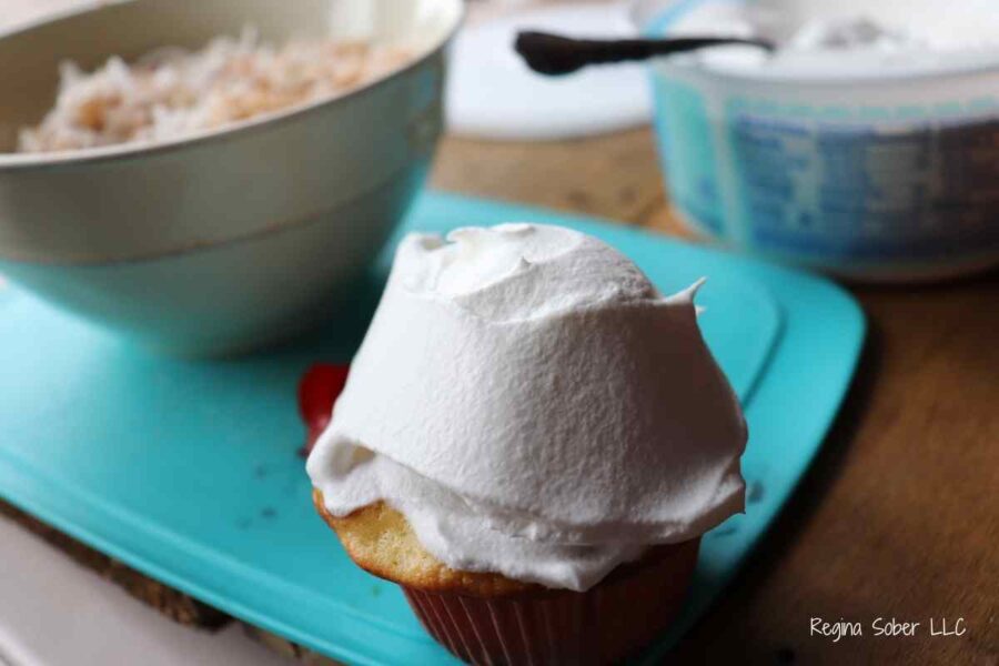 whipped topping on cupcake
