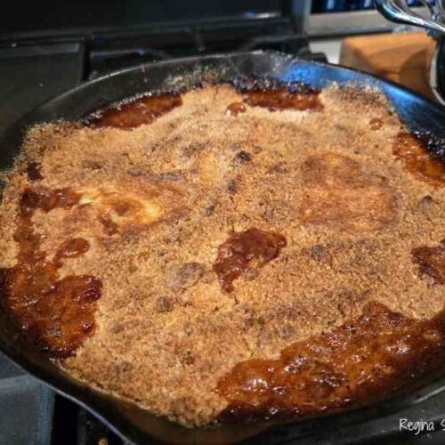 baking peach cobbler carmalized the sauce darkening it into a rich flavor.