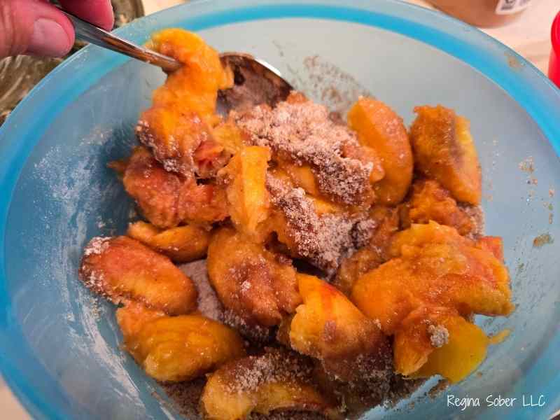Covering the peaches in the delicious spices