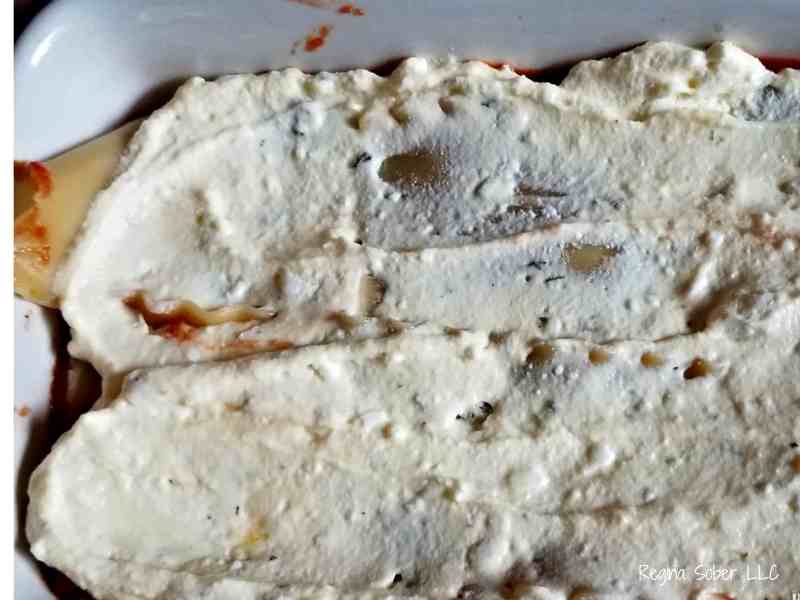 ricotta cheese layered over lasagna noodles