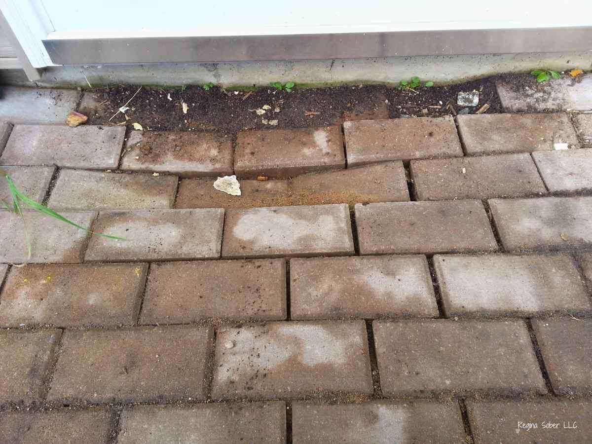 sunk pavers in sidewalk