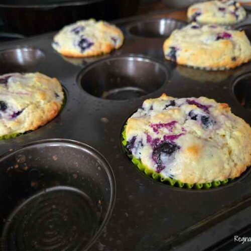 blueberry muffins in muffin tin