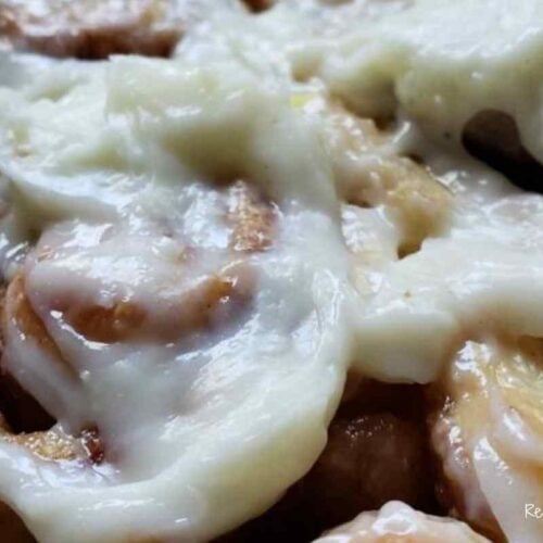 glazed cinnamon roll with cream cheese frosting