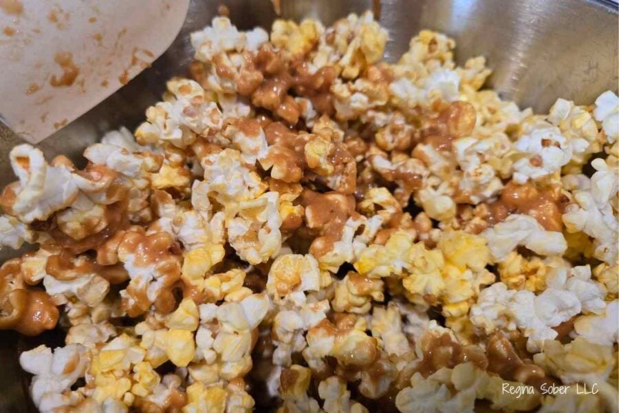 mix popcorn to coat and get caramel everywhere