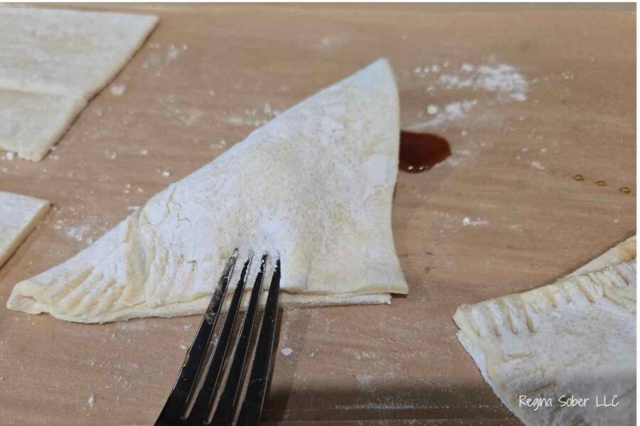 crimp the edges closed with a fork so the apples don't slip out