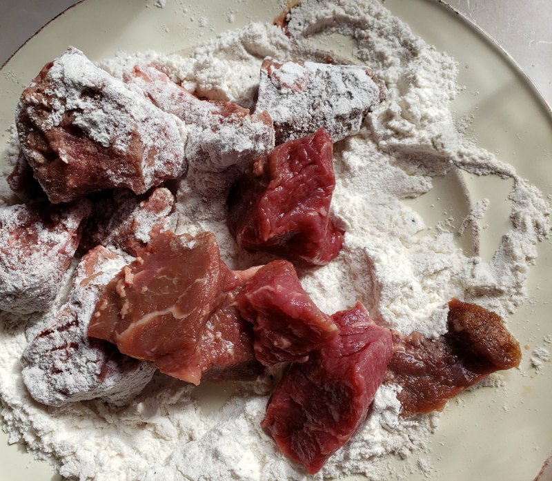 coat the beef with flour will help the broth thicken as it cooks without lumps