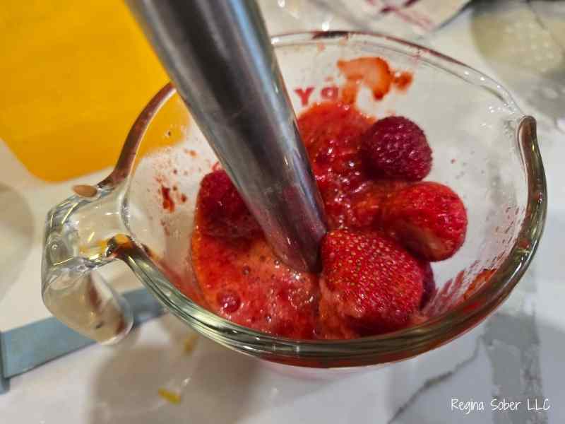 blend the strawberries until they are a puree. cover to keep them from making a mess