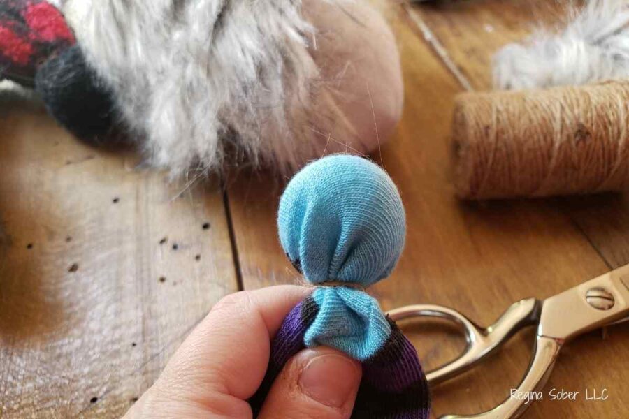 use rubber bands to make the ball at the end of the hat.