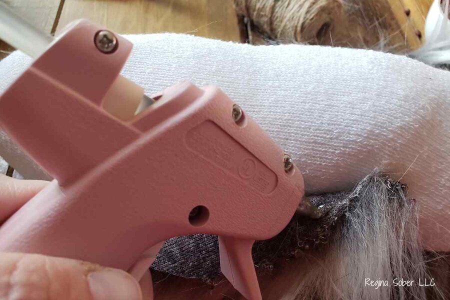 secure the fur to the sock with glue