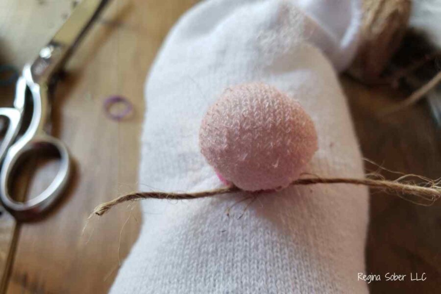tie string around to make a nose and color it with blush