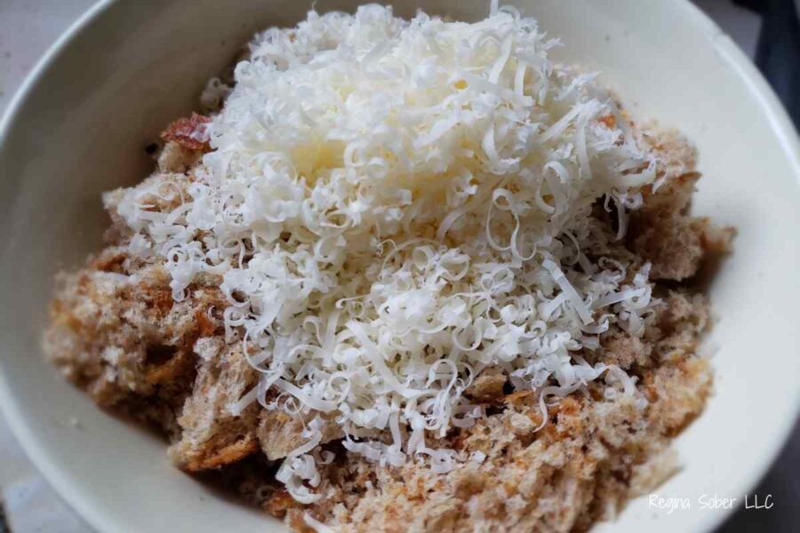combining bread crumbs and cheese to make topping