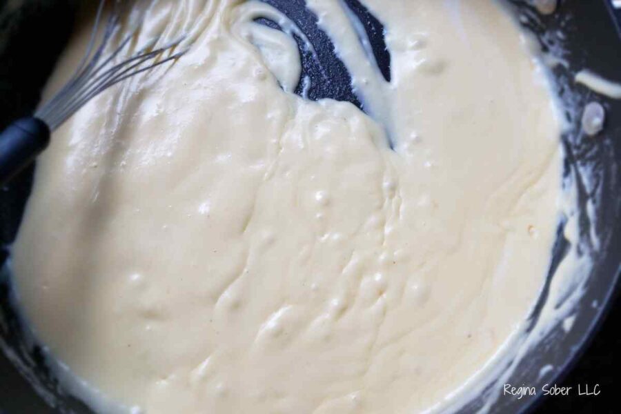 melted cheese sauce in a pan