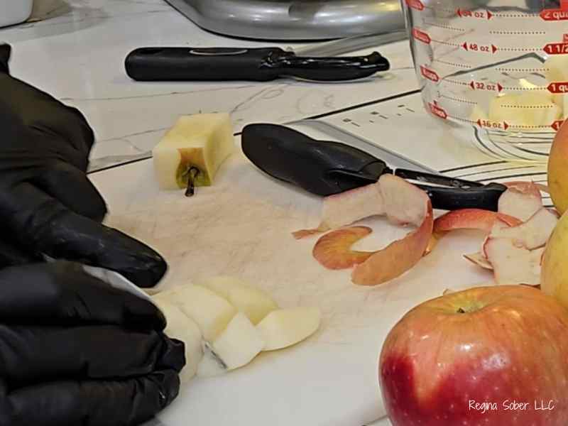 peeled apples cutting with knife