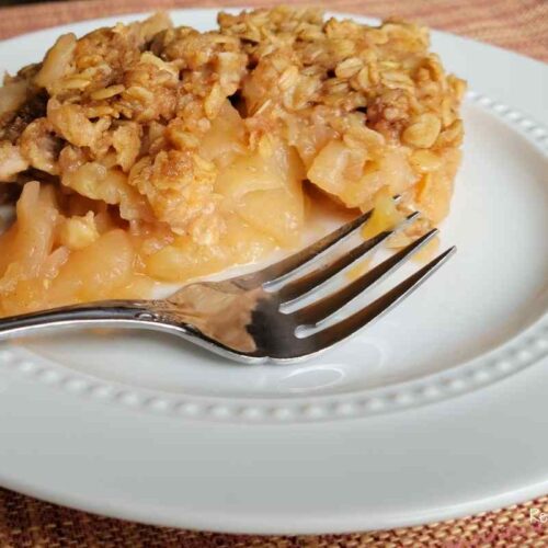plate of apple crisp with fork