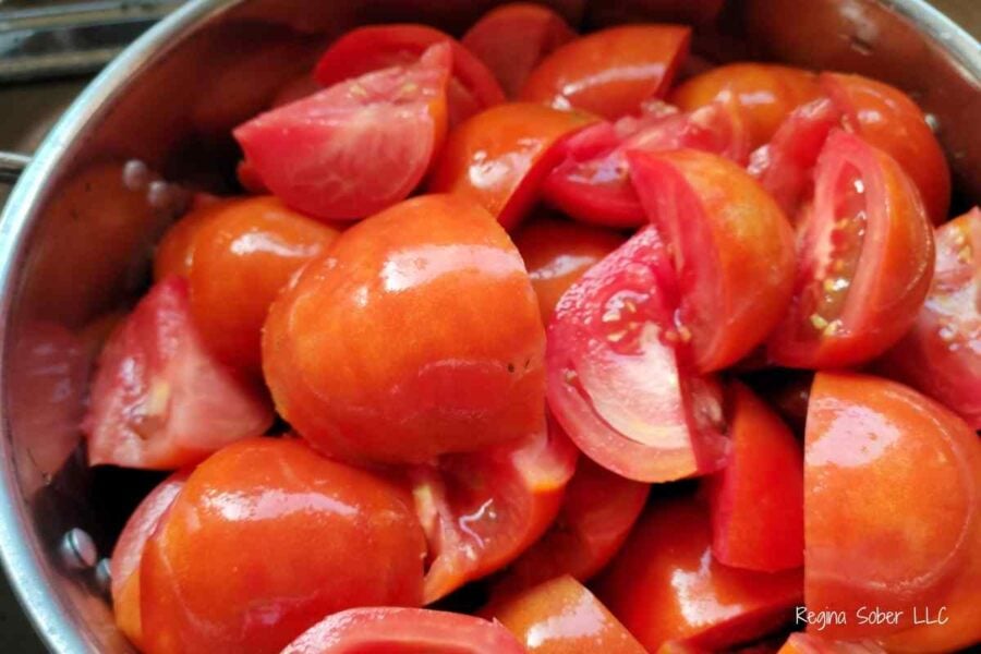 quarter the tomatoes so that they easily break down for pureeing
