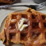 pumpkin waffles with butter and syrup