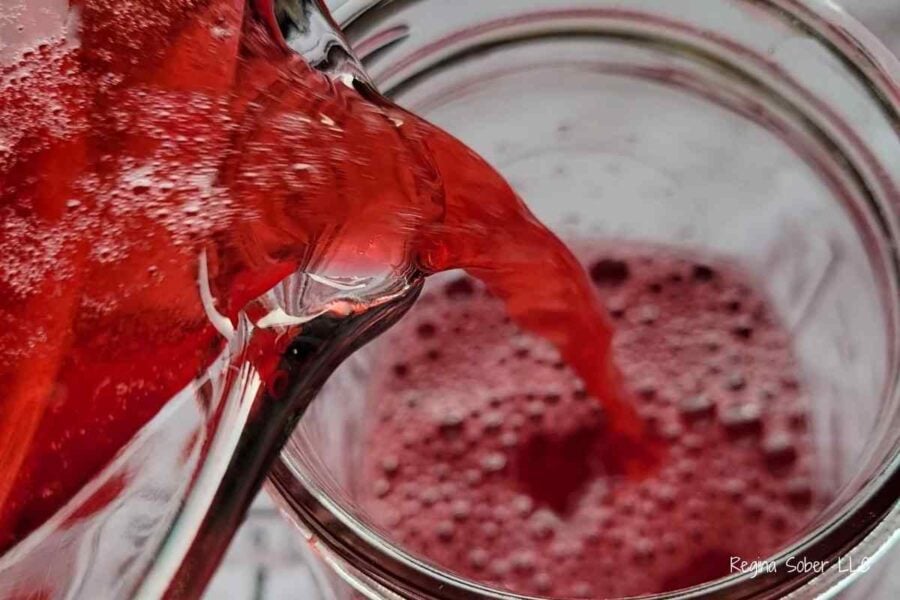 extracting cranberry juice and pouring