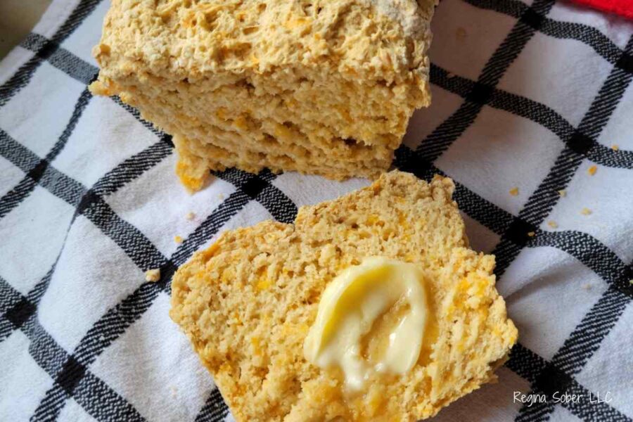 slice of beer cheese bread with a dollop of butter