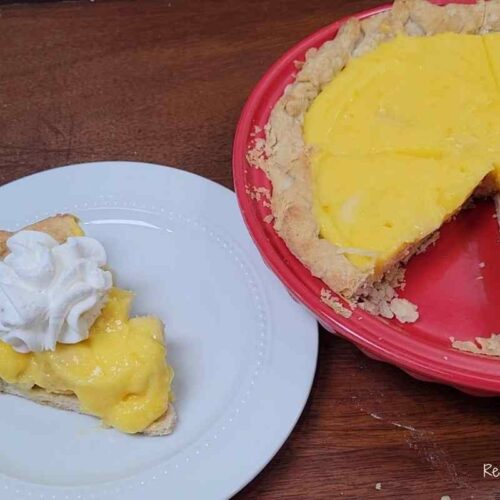 plated slice of homemade banana cream pie with whipped cream