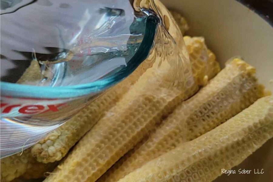 water on corn cobs