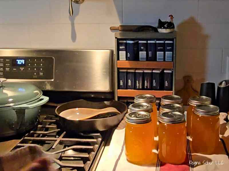 processed jars on counter top covered in towel