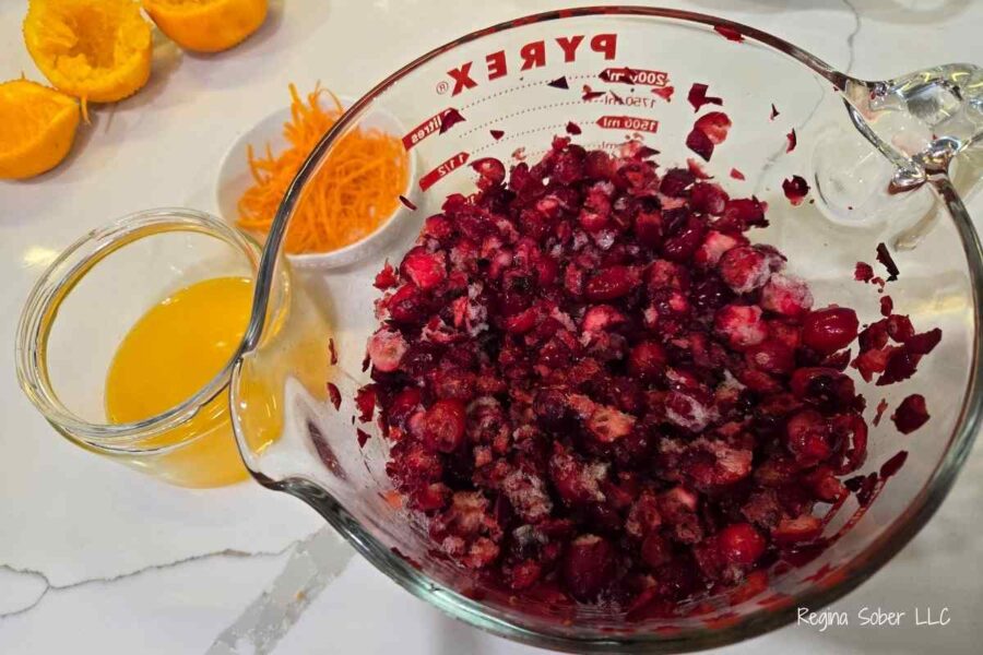 crushed cranbierres, orange zest and orange juice added into a dutch oven