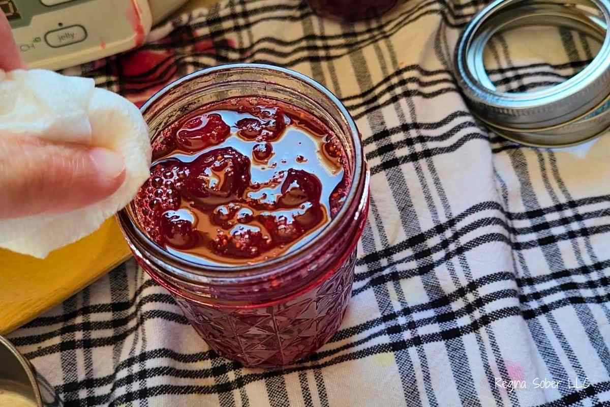 using a clean wet towel,wipe the rim of the jar