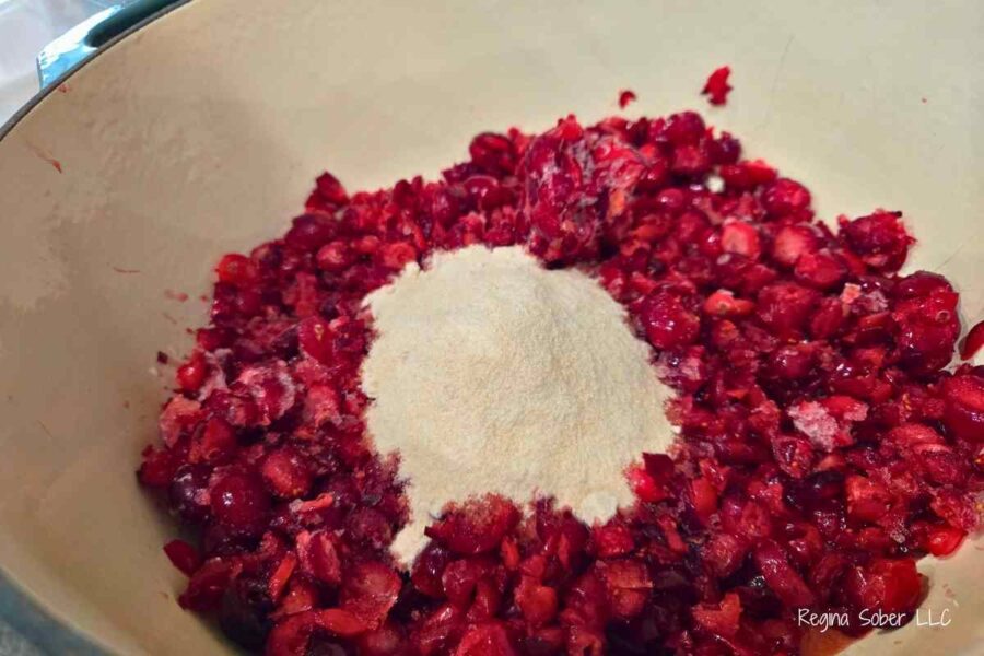 making christmas jam adding pectin