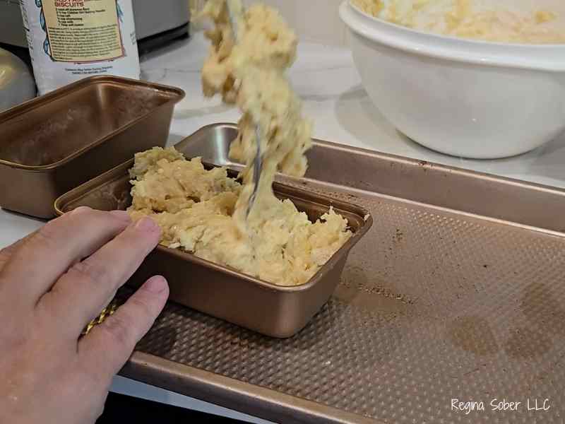 pressing the batter down to remove any air pockets