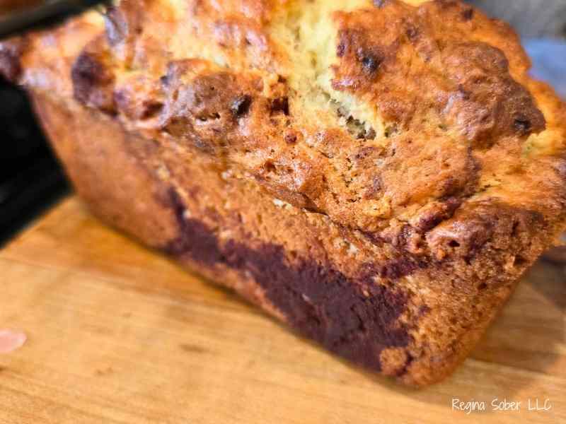 baked cinnamon banana bread with the ribbon in the middle