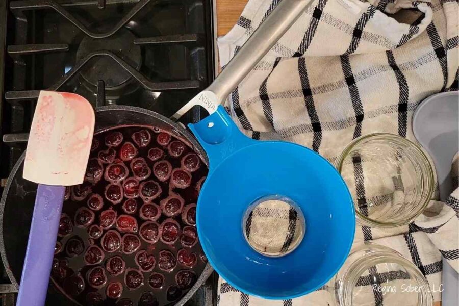 soaked cherries in hot liquid with pint jars to can