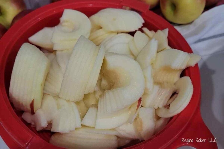 apple pieces and slices in bowl ready to can