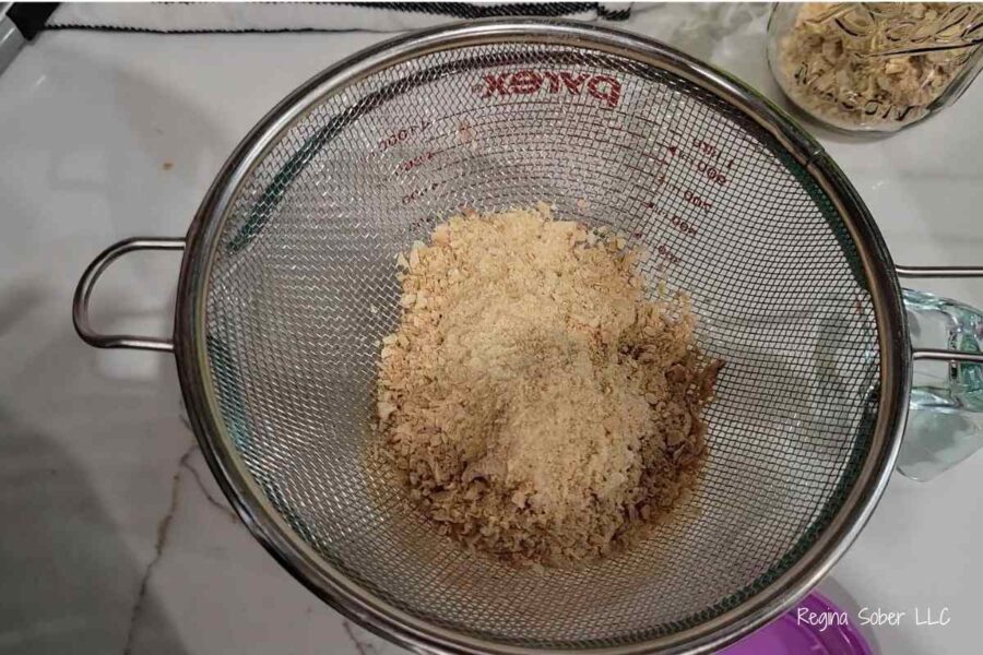 dehydrated onion flakes in metal sifter
