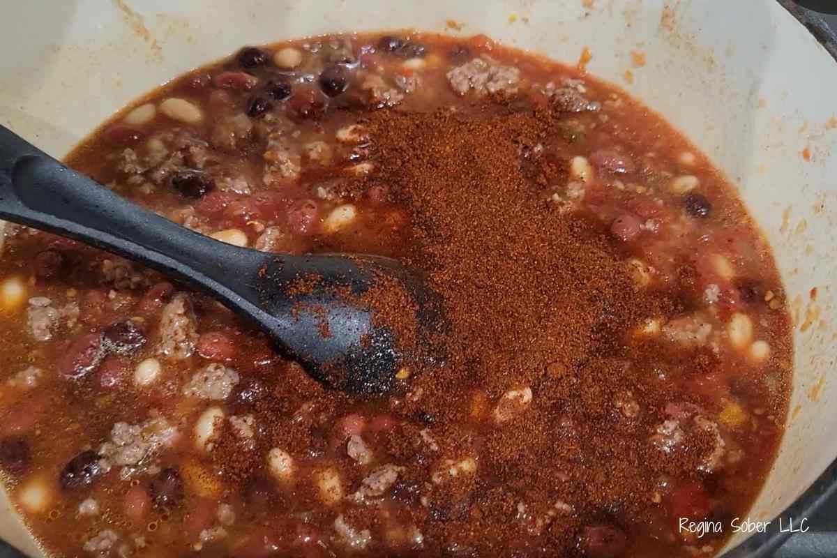 dutch oven with chili powder on chili