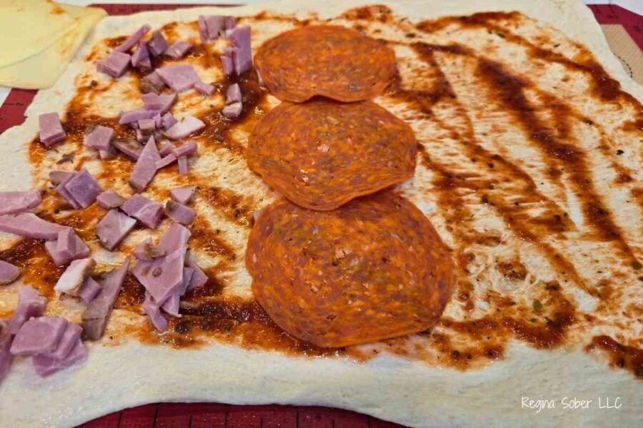 add your favorite pizza toppings. larger pieces are easier to roll