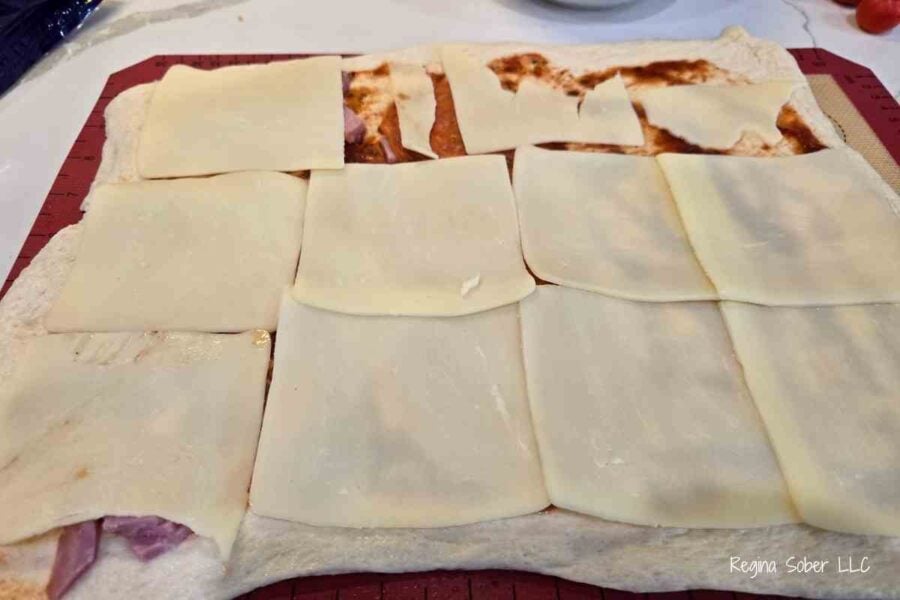 sliced mozzarella cheese is easier to roll than shredded