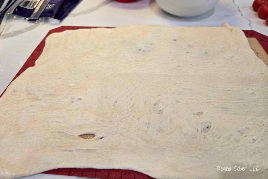 stretch dough out as evenly as possible