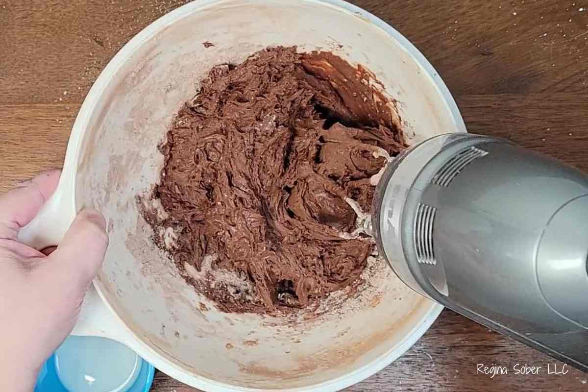 whipping and mixing the frosting until creamy and smooth