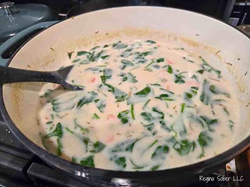 spinach in pot of soup