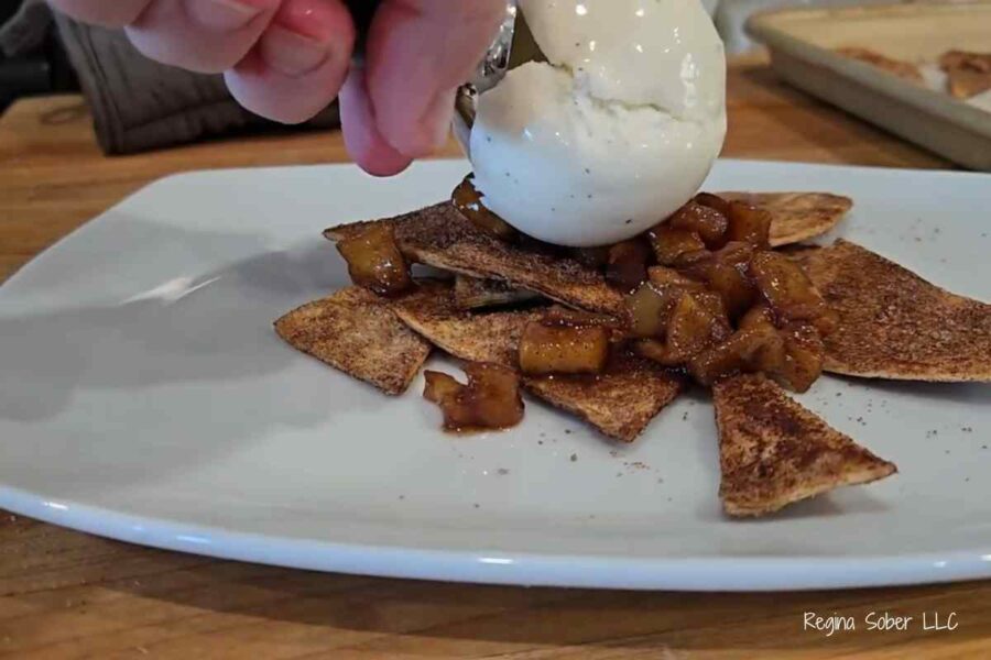 top the nachos with ice cream and a caramel drizzle