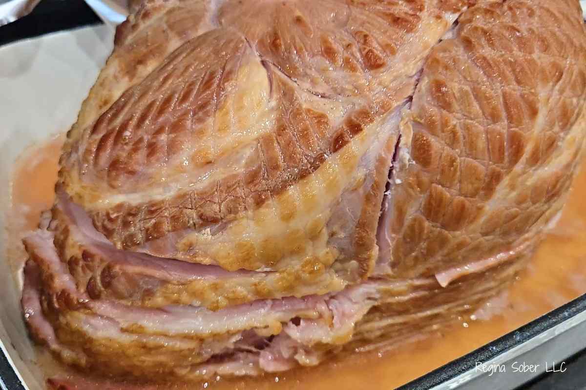 uncooked but precooked spiral ham in roasting pan