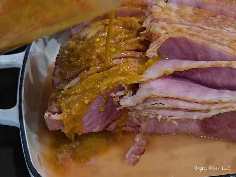 mustard glaze poured on ham