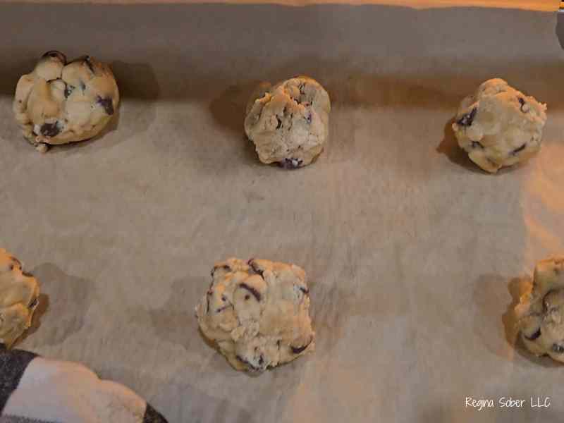 cookie dough balls on parchment paper